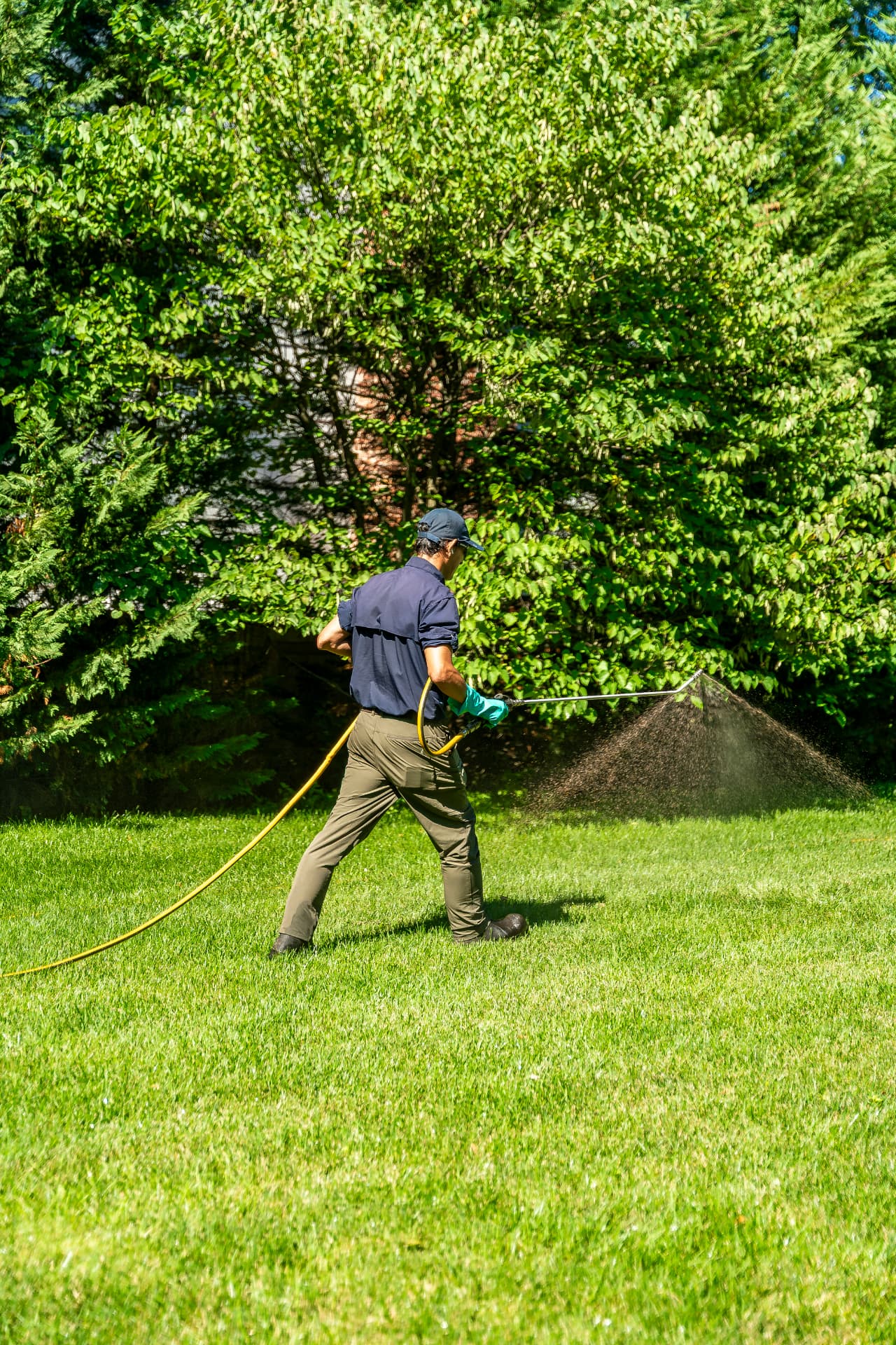 Liquid aeration soil-conditioning treatment being applied to a New Jersey lawn