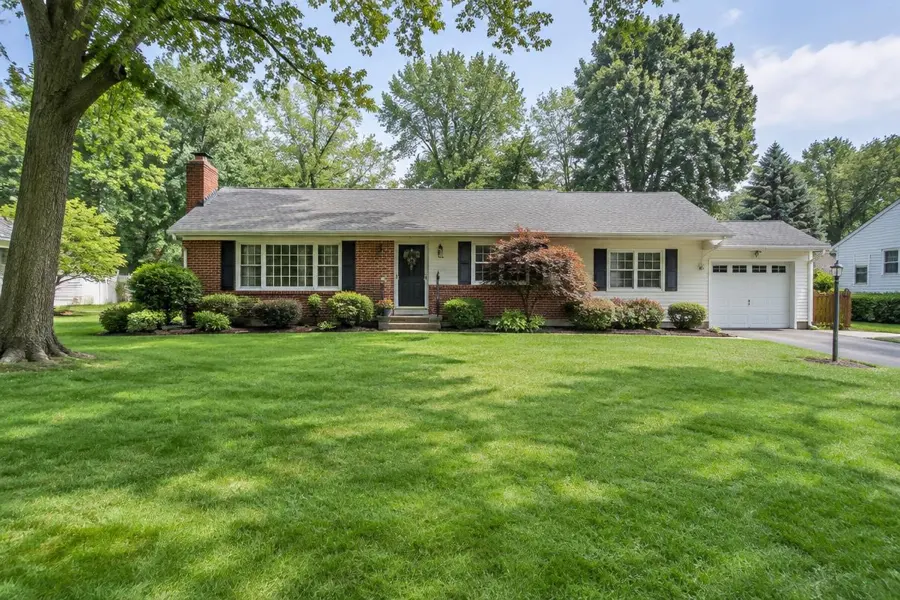 Brick ranch home with a wide green front lawn on a larger lot in Clark, NJ