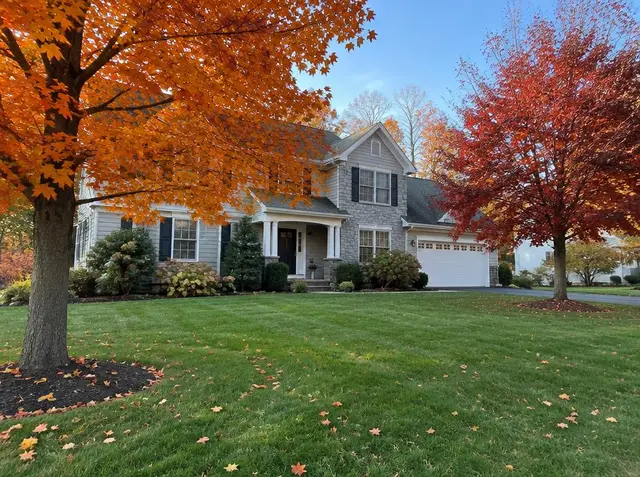 Healthy fall lawn with orange maple leaves at a New Jersey home