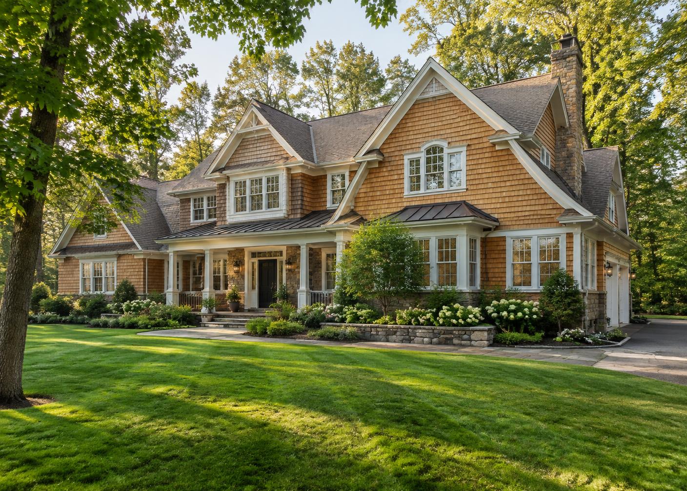 Newly built shingle-style luxury home with a green lawn in a wooded Northern New Jersey neighborhood